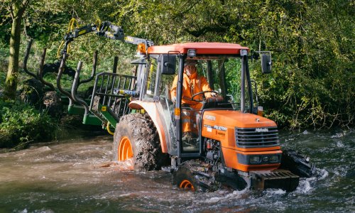 Tractor crossing river